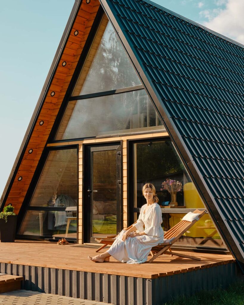 woman sitting in front of her solar powered home