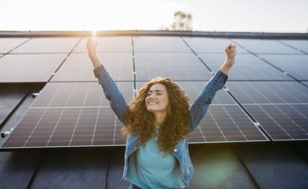 MD woman in front of solar panels