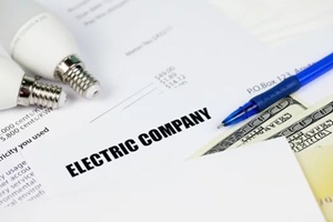 concept of saving money by using energy savings led light bulbs and electric bill payment