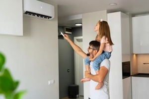 man adjusting home ac