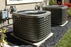 two new HVAC units installed by professional services on gravel base outside Maryland residential building
