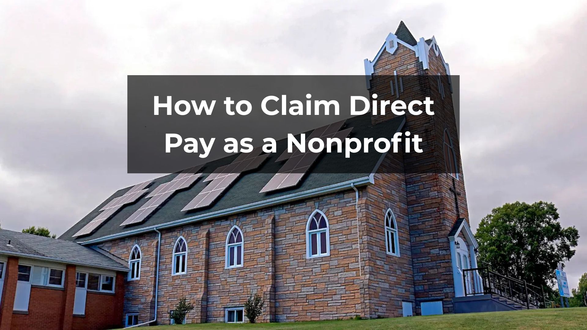 A traditional stone church with a green shingled roof has modern solar panels installed on it. A title card across the image says, "How to Claim Direct Pay as a Nonprofit."