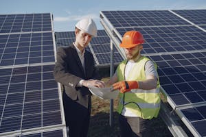 Electricians Inspecting Solar Panels Under Power Purchase Agreements