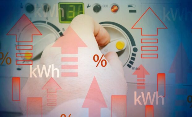 gas price increase concept with kWh symbols, red arrows and hand adjusting thermostat