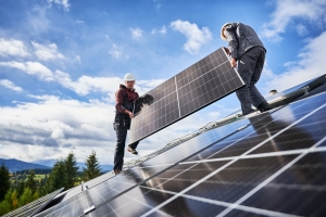 Workers Installing Solar Panels Outdoors