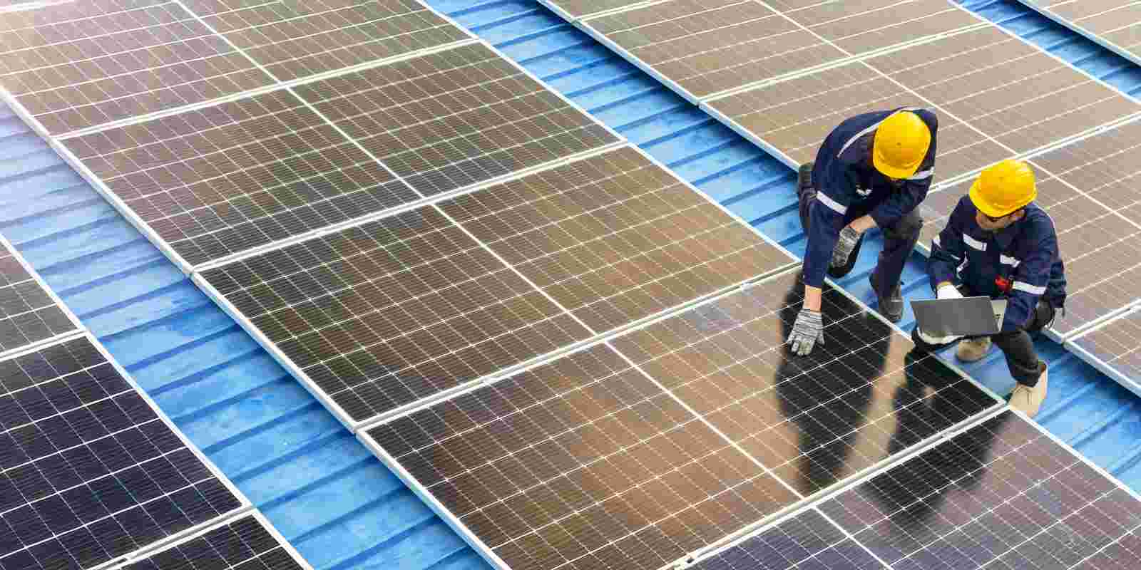 Professional Inspecting Solar Panel Installations on A Rooftop