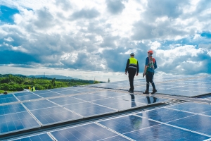 Technician Engineer Checking Solar Cell on Rooftop