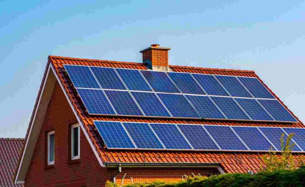 Solar Panels on a Residential House Roof to Reduce Carbon Footprint