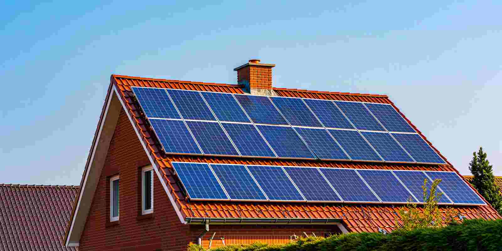 Solar Panels on a Residential House Roof to Reduce Carbon Footprint