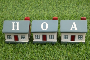HOA with Three Miniature Houses on Artificial Green Grass