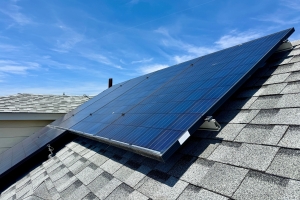 Solar Panels Installed on Roof of House with Shingles