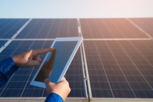 Technician Analyzing Reasons for Underperformance Solar Panels