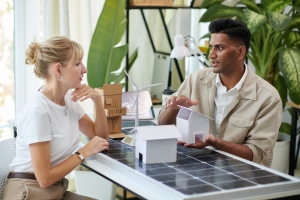 Homeowner Talking to Solar Company Executive about Battery Storage System