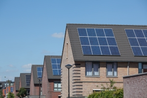 Modern Houses with Solar Panels on the Roof for Sustainable Energy