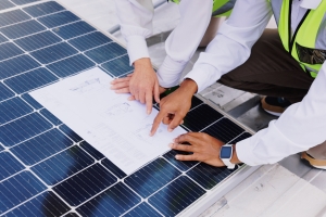 Solar Technicians Reviewing Site Plans and Structural Documentation